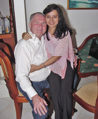 A charming Colombian bride sitting on the lap of her possible match