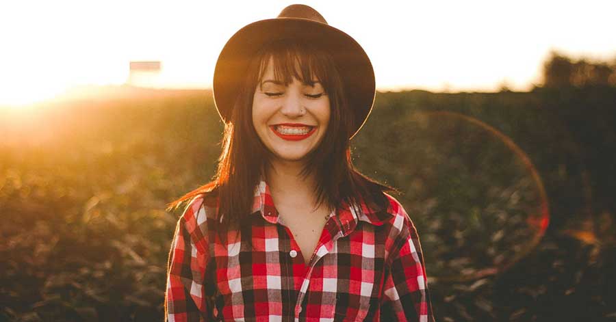 girl smiling with eyes closed